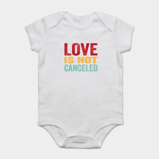love is not cancelled Baby Bodysuit